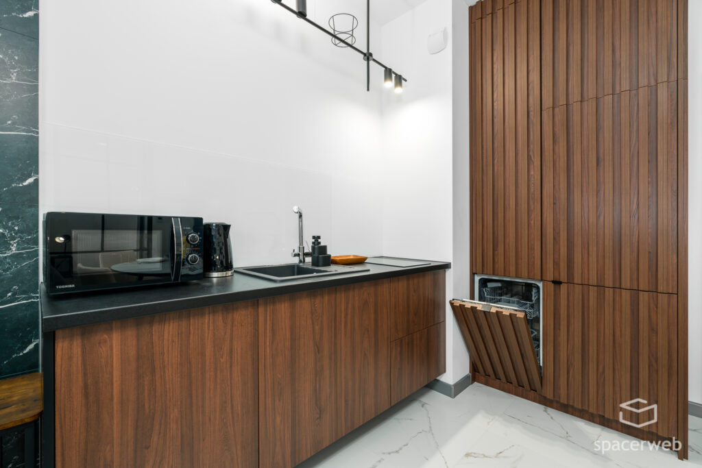 Fotografia wnętrz - Salon ze stołem i aneks kuchenny